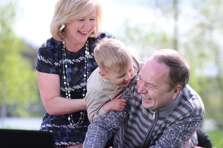 grandparents babysit his grandson in the park