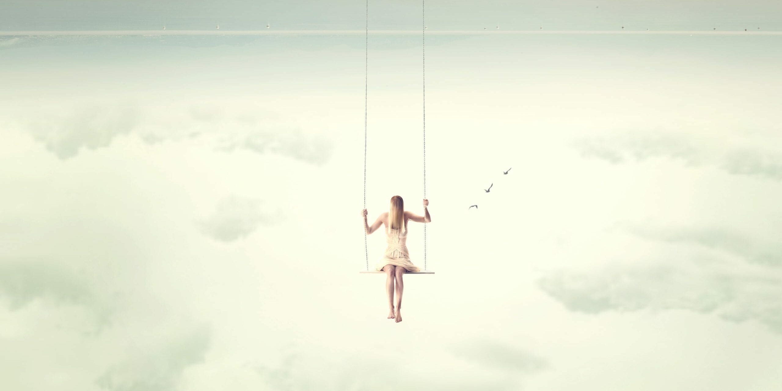 upside down surrealistic minimal woman swings in the air